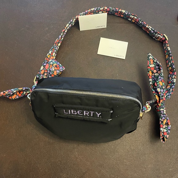 Reversible Floral/Black Crossbody Bag - Picture 6 of 9